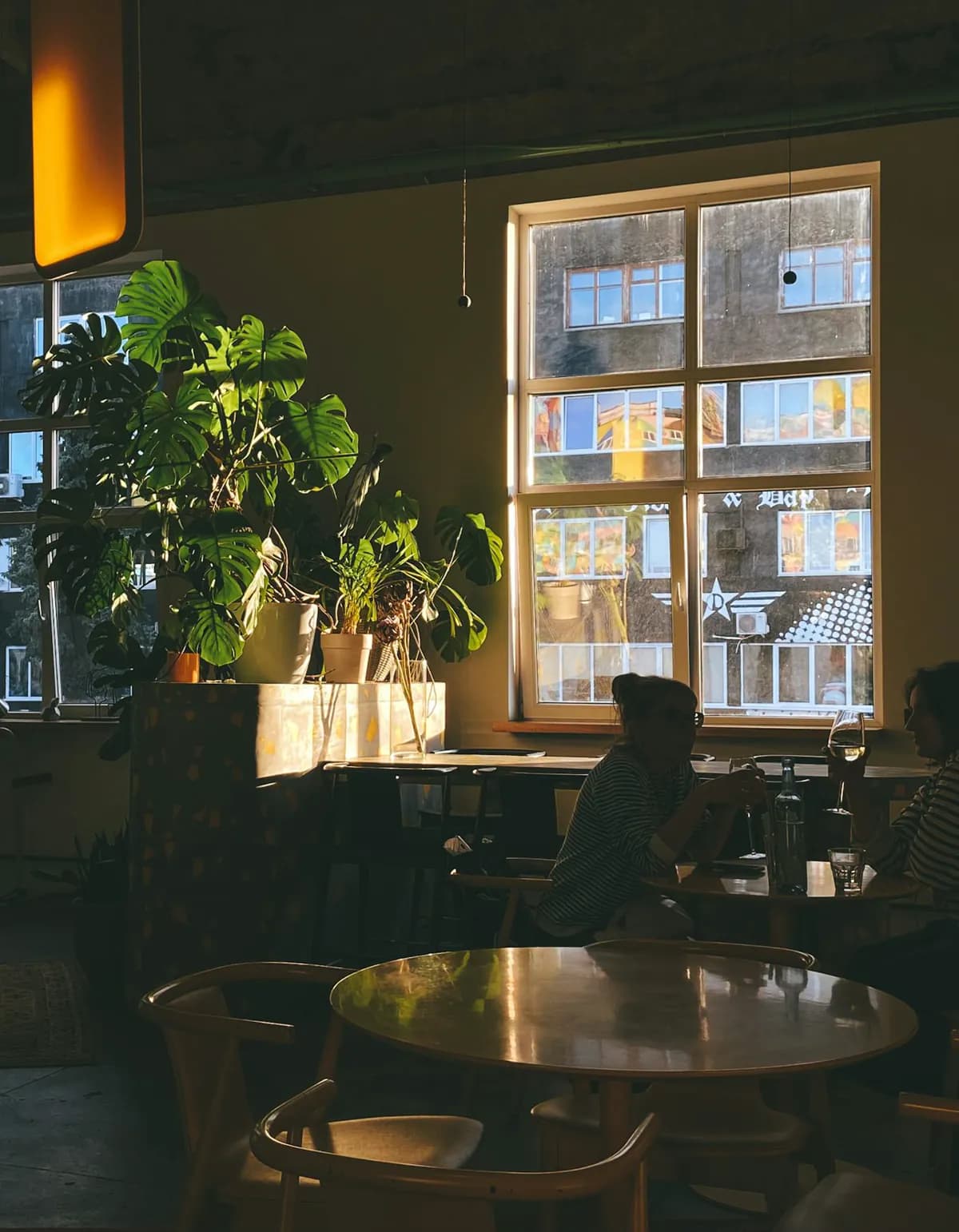 Neighbors gathered together in a bright local setting